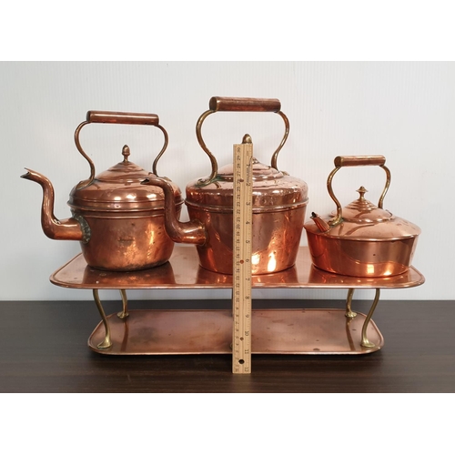 75 - Three Copper Kettles on Warming Plate