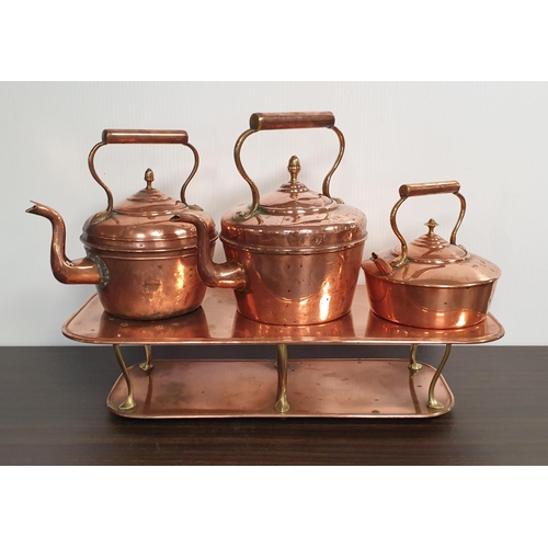 75 - Three Copper Kettles on Warming Plate