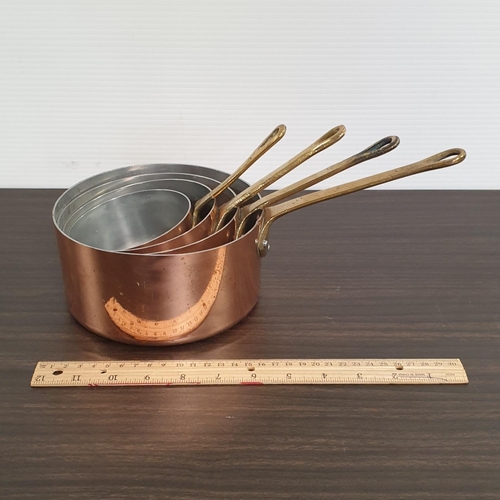 205 - Four Nesting Copper Saucepans with Brass Handles