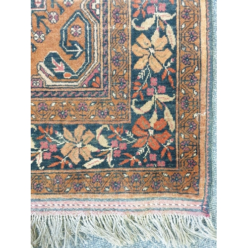 406 - Persian Style Orange Ground Rug, L:160 x W:100 approx.