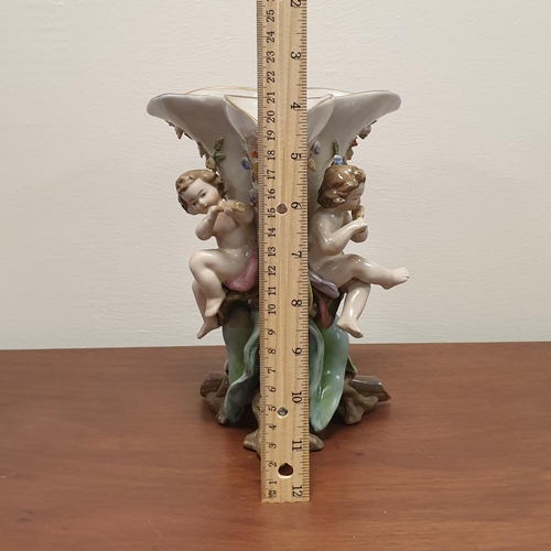 527 - Continental Porcelain Vase with Cherub Figures, Height 25cm, and Porcelain Candle Holder