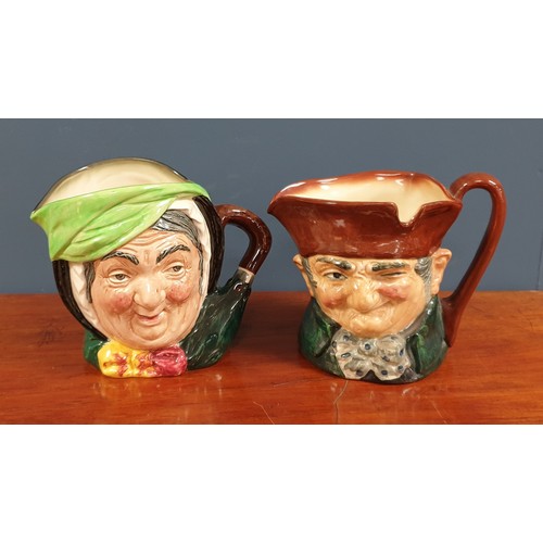 643 - Lot of Four Royal Doulton Toby Jugs - Old Charley and Sairey Gamp. Height 15cm