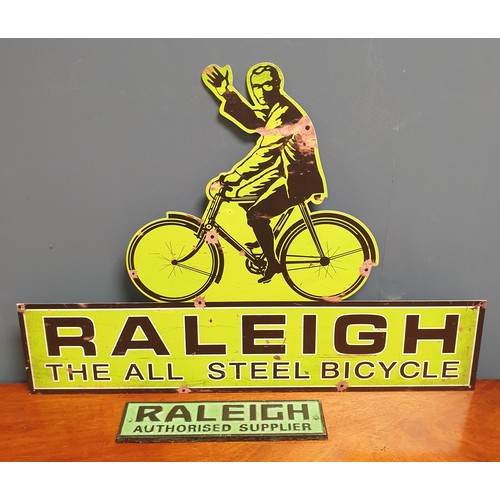 775 - Raleigh Tin Sign and Cast Iron Sign