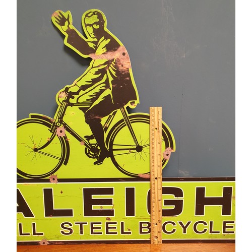 775 - Raleigh Tin Sign and Cast Iron Sign