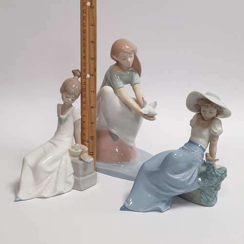 136 - Three Nao Porcelain Figures, Girls Seated with Birds Tallest 21cm