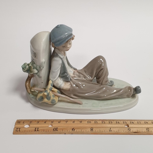 798 - Lladro Porcelain Figure with Box Boy Seated against wall approx. L: 18cm x h:11.5cm