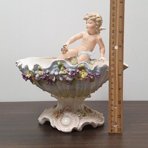 17 - Porcelain dish with cherub, H:23 x W:23 x D:15cm (some damage to wing and flowers)