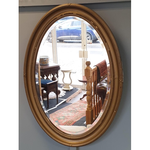 71 - Gilt framed oval wall mirror, H:89 x W:64cm