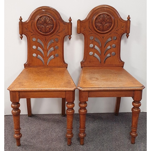 104 - Pair of oak hall chairs, some damage