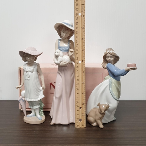 919 - Three Nao porcelain figures, one boxed. Tallest 25cm