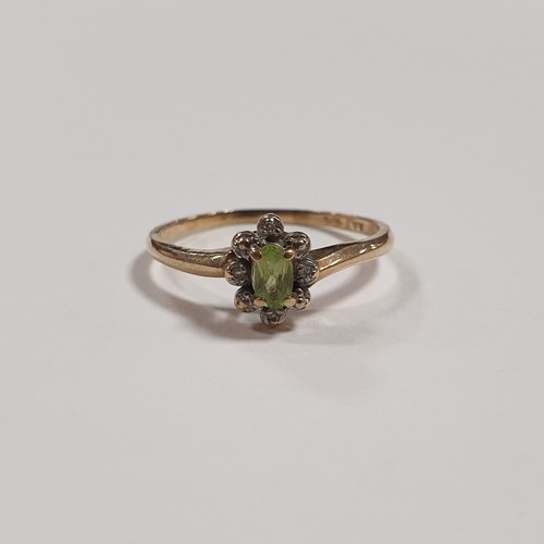 572 - 10K Gold Ring with Centre Green Stone and Diamonds Size T