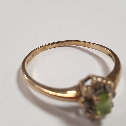 572 - 10K Gold Ring with Centre Green Stone and Diamonds Size T