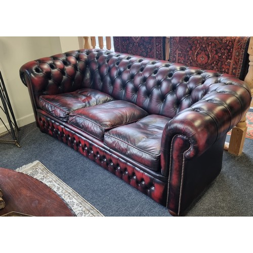 77 - Oxblood Leather Chesterfield Three Piece Suite comprising 3 seater sofa and two armchairs
3 Seater -... 