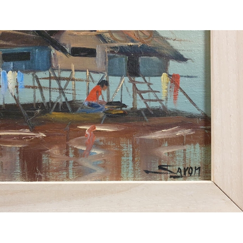 169 - Pair of Framed Oils on Board, Floating Village Scene Signed Aron. H:57 x W:67cm