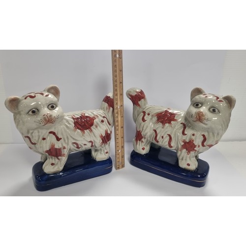 23 - Pair of Ceramic  Staffordshire Style Cat Figures, H: 21cm x L: 24cm each