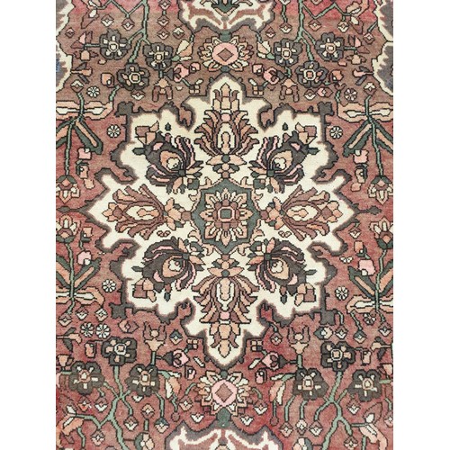 65 - Washed Red-Ground Handwoven Village Rug with Floral Medallion Design, 200cm x 135cm