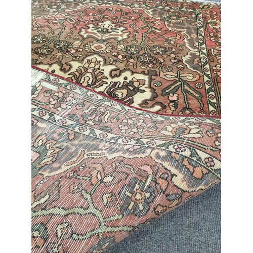 65 - Washed Red-Ground Handwoven Village Rug with Floral Medallion Design, 200cm x 135cm