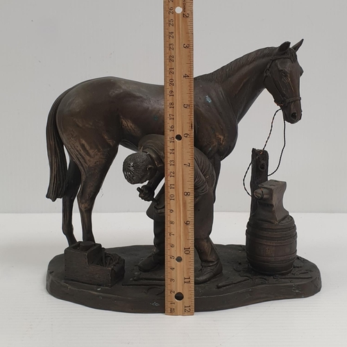 329 - Genesis Ornament - Farrier and Horse. Height 24cm