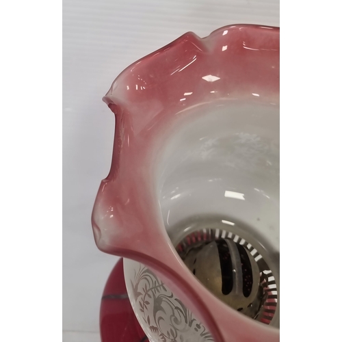 89 - Antique Cranberry glass column oil lamp, H: 76cm