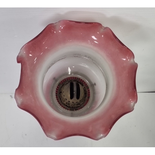 89 - Antique Cranberry glass column oil lamp, H: 76cm