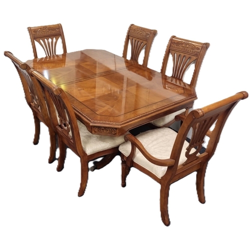 76 - Seven-piece walnut-finish dining suite (table and six chairs) H:76cm x L:173cm x D:114cm.