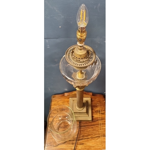 88 - Brass-finish column table lamp with glass reservoir and shade H:75cm x W:17cm.