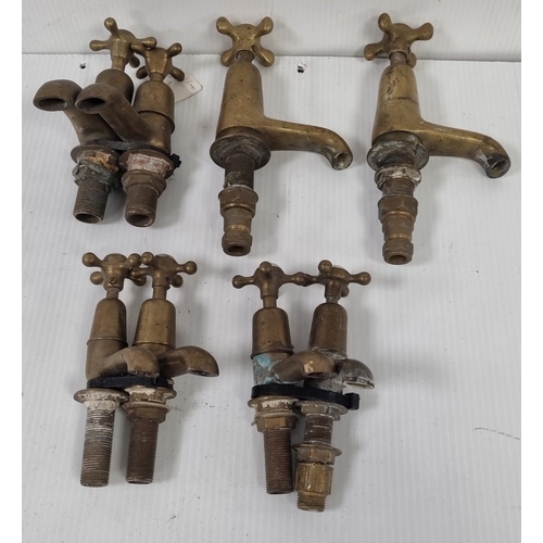 101 - Set of 4 brass taps and basin mixers