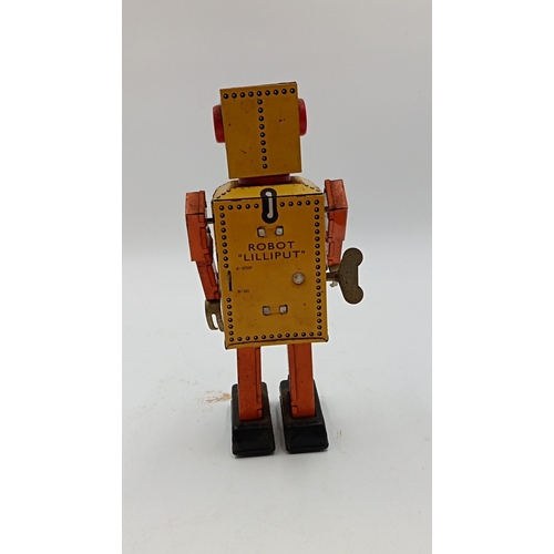 218 - Clockwork tinplate robot toy, 