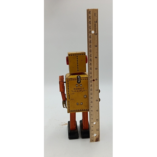 218 - Clockwork tinplate robot toy, 