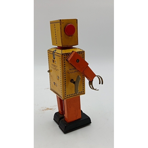 218 - Clockwork tinplate robot toy, 