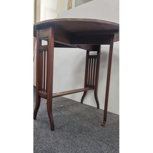 104 - Walnut-finish oval drop-leaf occasional table on castors H:68cm x W:84cm x D:69cm.