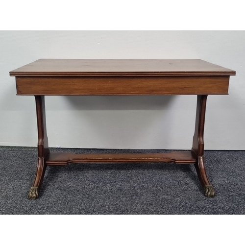 107 - Regency style mahogany coffee table with brass paw feet, H: 51cm x W: 76cm x D: 45cm