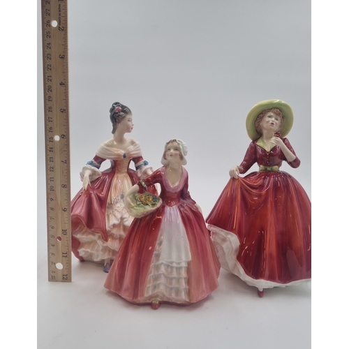 119 - - Set of three Royal Doulton figures—“Southern Belle” HN 2229, “A Single Red Rose,” and “Janet” HN 1... 