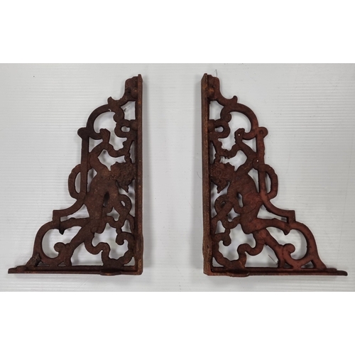 196 - Pair of cast iron putto shelf brackets H:37cm x W:26cm x D:6 cm.