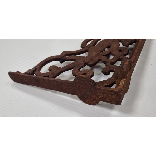 196 - Pair of cast iron putto shelf brackets H:37cm x W:26cm x D:6 cm.