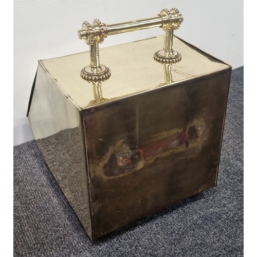 220 - Brass slope front coal scuttle with embossed classical panel and handle H:40cm x W:29cm x D:40cm.