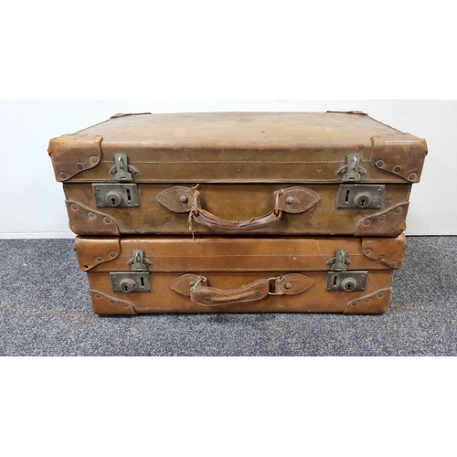 87 - Pair of vintage tan leather suitcases