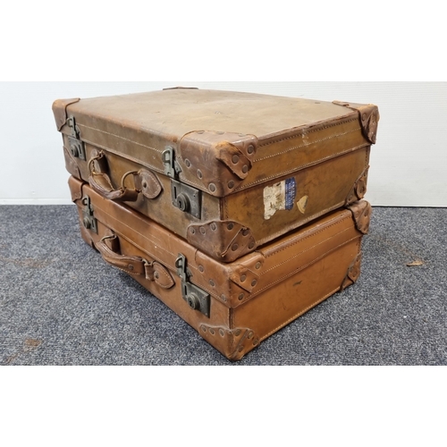 87 - Pair of vintage tan leather suitcases