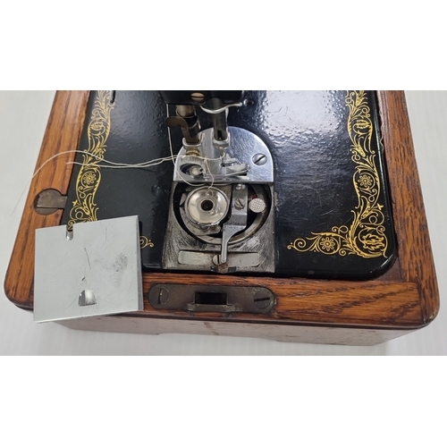 206 - Singer hand-crank sewing machine in carry case, serial no. EB386837