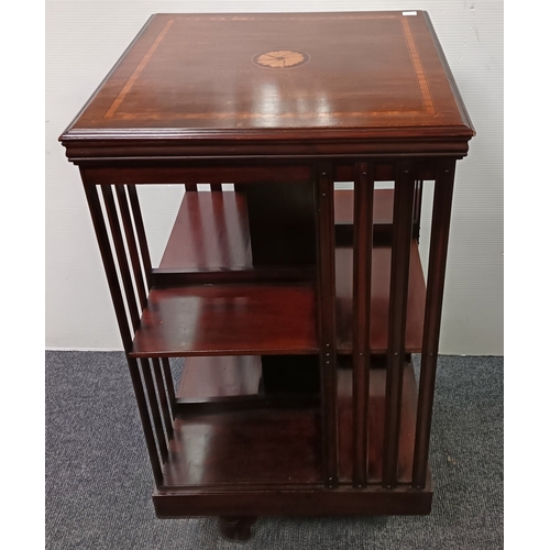 106 - Revolving mahogany bookcase with inlaid top, H: 87cm x W: 47cm x D: 47cm