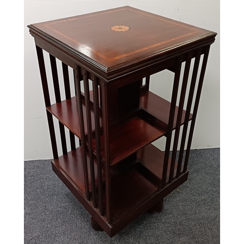 106 - Revolving mahogany bookcase with inlaid top, H: 87cm x W: 47cm x D: 47cm