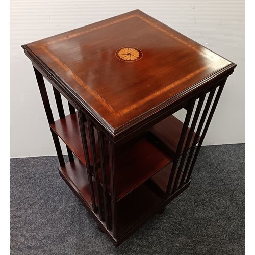 106 - Revolving mahogany bookcase with inlaid top, H: 87cm x W: 47cm x D: 47cm