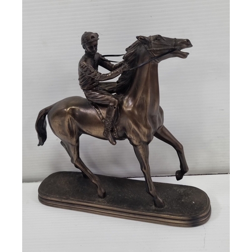 236 - Signed bronze-effect racehorse and jockey figure on oval base