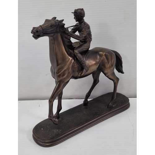 236 - Signed bronze-effect racehorse and jockey figure on oval base