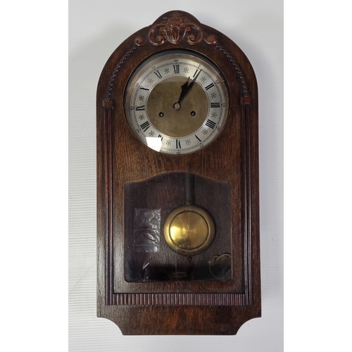 227 - Carved wooden wall clock with pendulum and key, H: 61cm x W: 31cm x D: 15cm