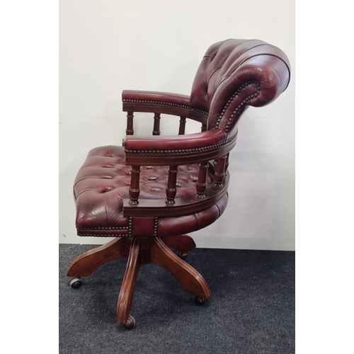 16 - Chesterfield-style  Burgundy leather swivel captains/desk chair, H: 66cm X W: 60cm X D: 39cm.