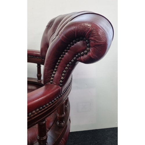 16 - Chesterfield-style  Burgundy leather swivel captains/desk chair, H: 66cm X W: 60cm X D: 39cm.