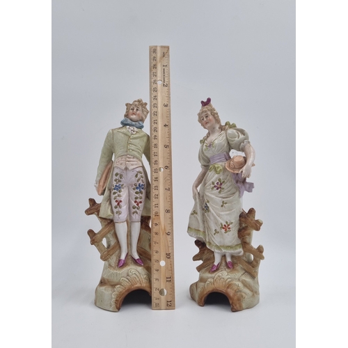 20 - Pair of porcelain figural statues, H: 24cm.