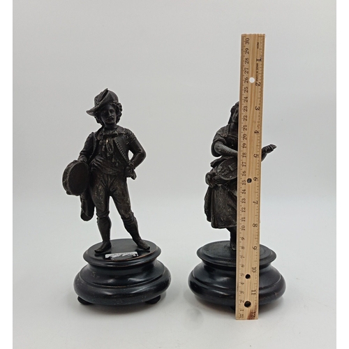 23 - Pair of patinated metal figures on plinths