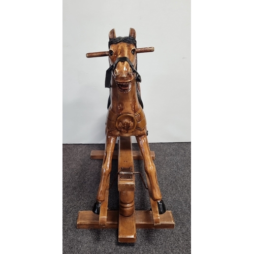 33 - Wooden rocking horse on trestle base, H: 86cm X W: 92cm X D: 46cm.